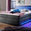 Bettkasten-Boxspringbett "Tollocan" 1 Bettkasten-Boxspringbett "Tollocan" -Bettbezüge Verkäufe 2024 bettkasten boxspringbett tollocan beleuchtung stylisch